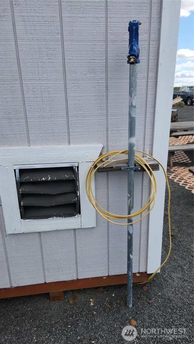 Water spigot plumbed out to the well