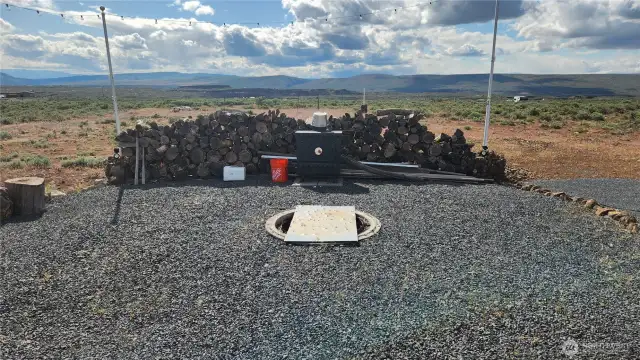 Firepit area with in ground pit & wood fireplace. Lots of wood to burn!