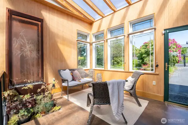 This haven provides year-round light and cozy navigation between the house, garage and yard space