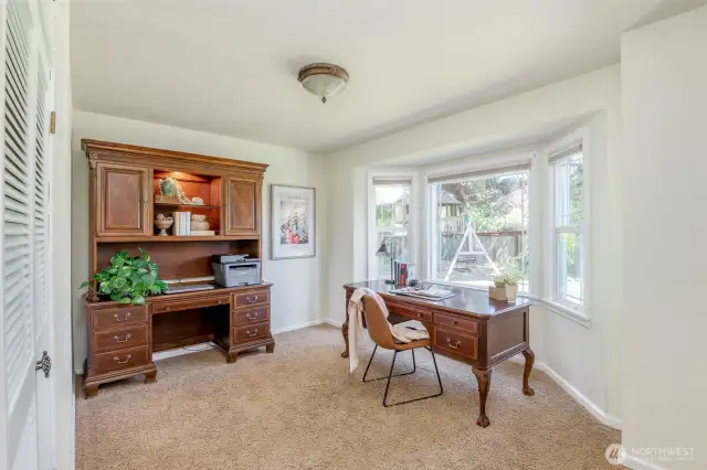 First of two main floor bedrooms, each with a East-facing bay windows for great morning light.