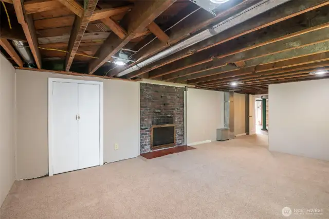 Lower level (accessed through atrium) with laundry, 3rd bath, rec room with fireplace and plenty of additional storage space + room for hobbies.