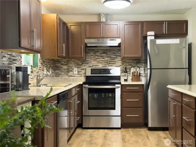 Beautifully updated kitchen with SS appliances & tile backsplash