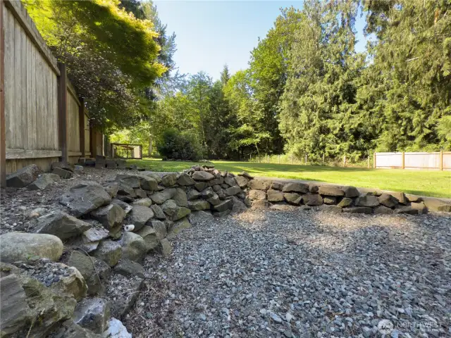 Huge, fully fenced backyard with patio, fire pit area & oversized dog kennel or chicken run.