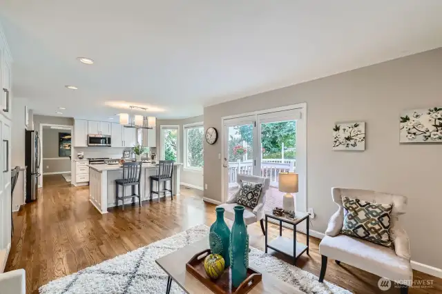 Family room opens directly to the kitchen and breakfast nook. Hardwood flooring continues throughout for a cohesive and modern layout.