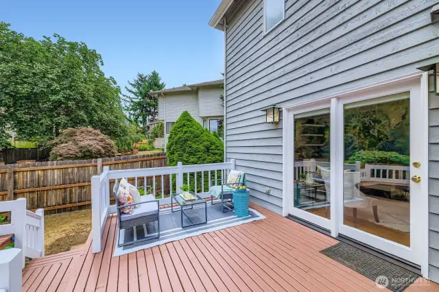 The Family Room opens to a sunny deck via glass sliders, extending your living space outdoors and offering room for alfresco dining.