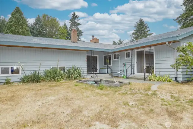 Both the master bedroom and dining room provide sliding glass doors for easy access to backyard.