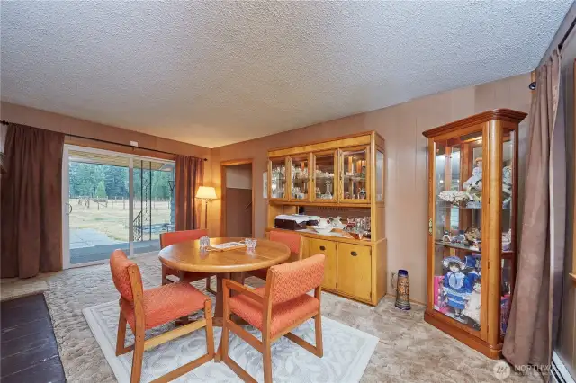 Enjoy peaceful pasture views from the dining room, with easy access to bonus rooms and the garage.