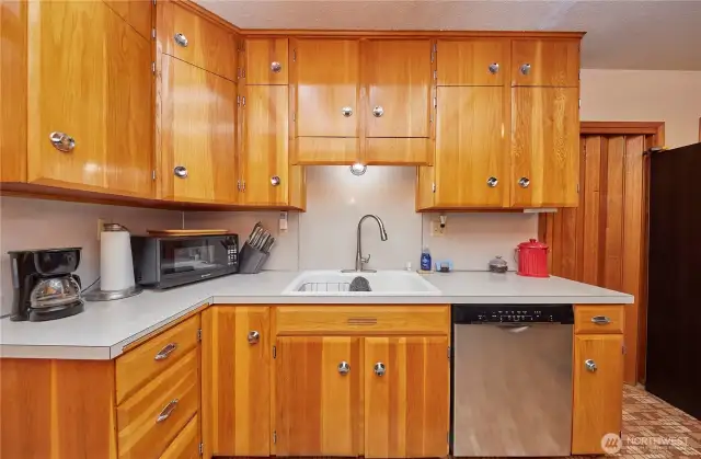 Kitchen features oak cabinets that add warmth and character to the space.