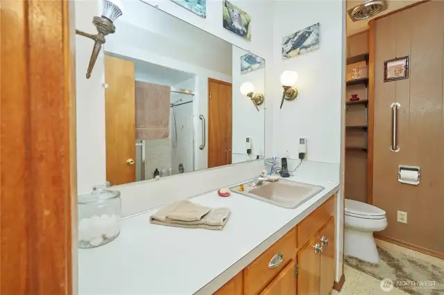 Easy-access bathroom adjacent to the living room for guests and family.