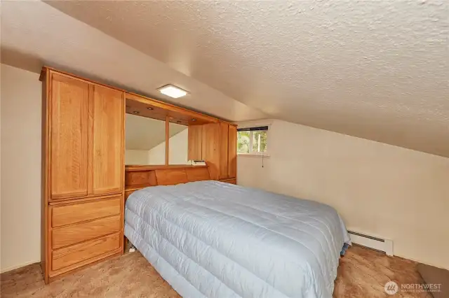 An inviting bonus room awaits upstairs, just steps from the dining space, offering flexibility and comfort.
