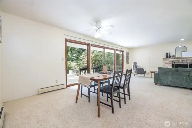 A large dining area is adjacent to the living room.