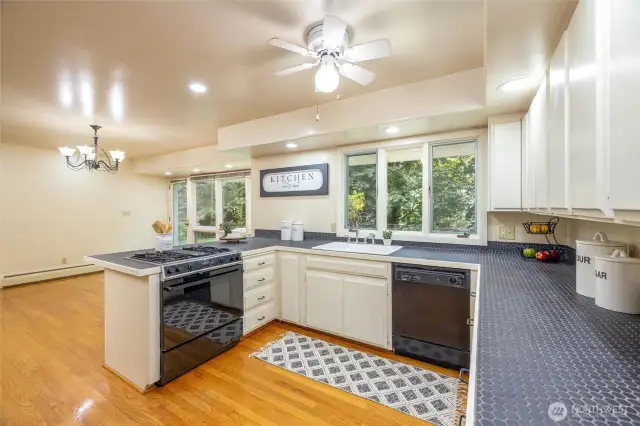 The kitchen is next to the formal dining area.