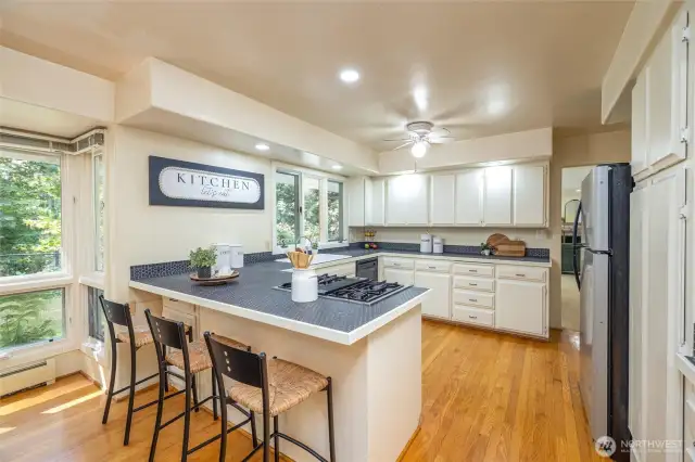 The kitchen features bar seating.