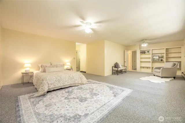 Upstairs you'll find a very large primary bedroom, complete with seating area.