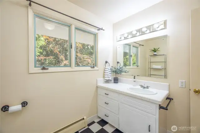 The upstairs full bathroom, accessible from the hallway.