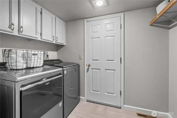 Laundry off of the kitchen leads to the large 3 car garage