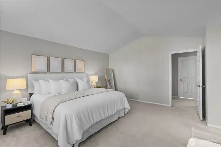 Vaulted ceilings give this bedroom a sense of space