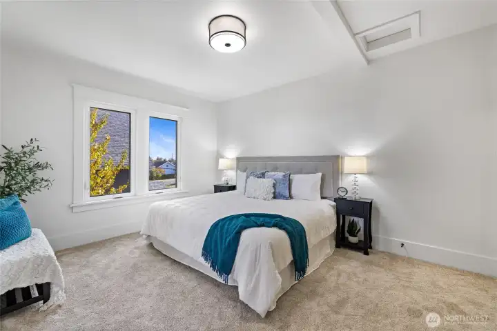 The primary bedroom is over-sized with excellent light, a walk-in closet, and an ensuite bathroom.