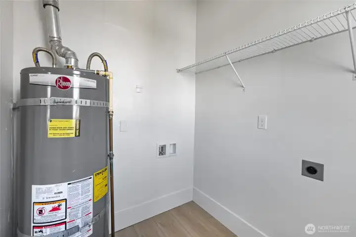 The utility room offers good storage and natural light.