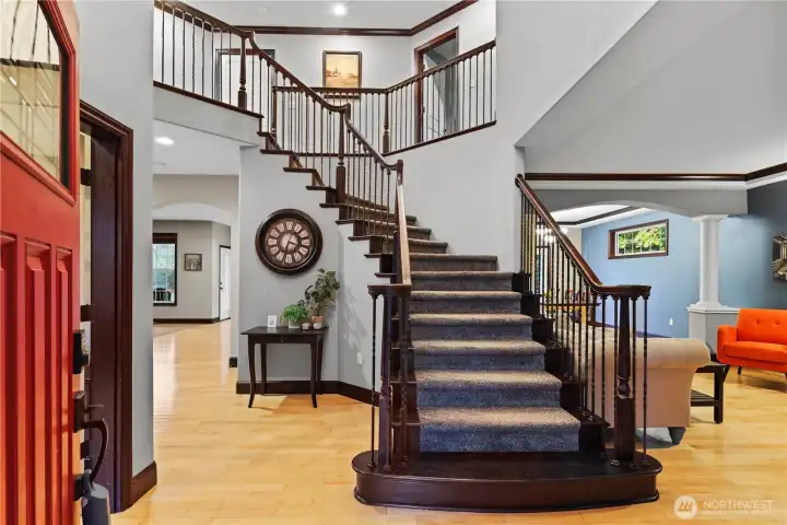 A grand staircase welcomes you into this lovely home