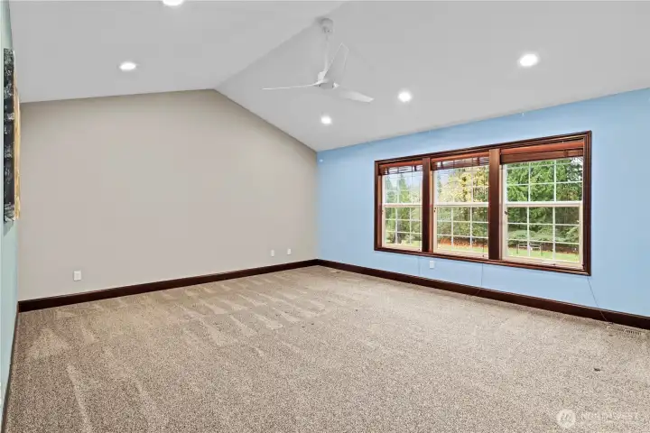 GENEROUSLY-sized primary bedroom overlooks the backyard