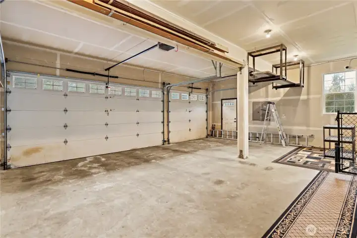 Generous 3-car space with extra high ceilings for storage