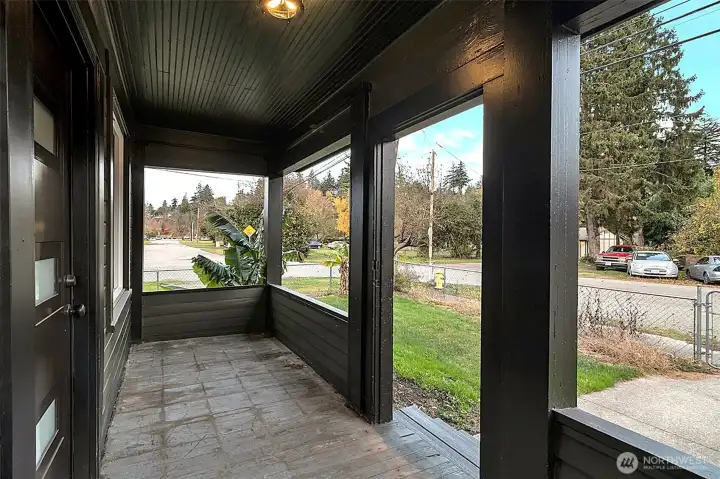 Covered front porch, new front doorway and lighting.