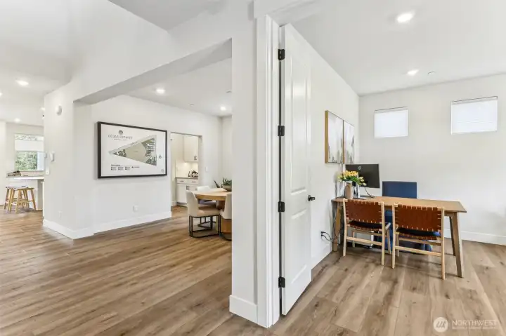 Pic is of model- Entry to home with Den on Right and dining on other side.