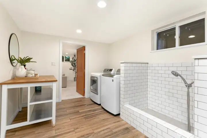Dreamy laundry room with a dog wash station!