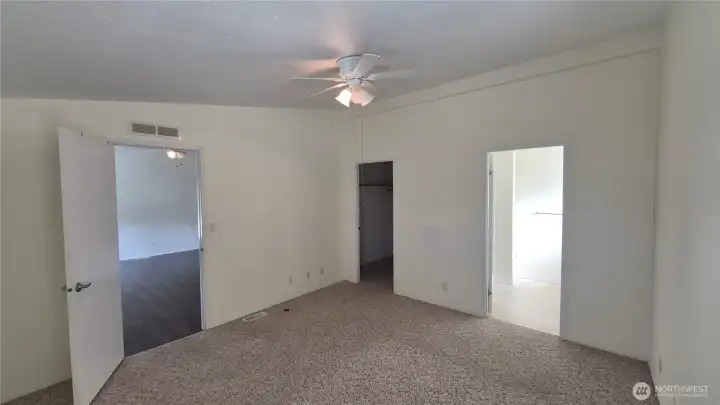 Main bedroom with walk-in closet and attached 3/4 bath.