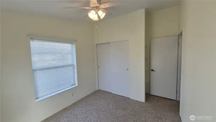 2nd bedroom with closet and built in shelves.