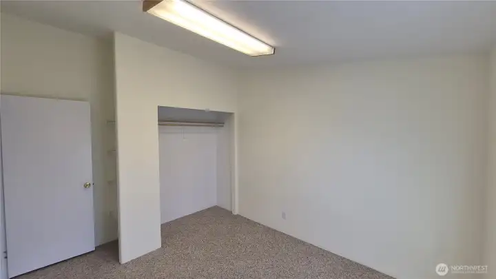 3rd bedroom with closet and built-in shelves.