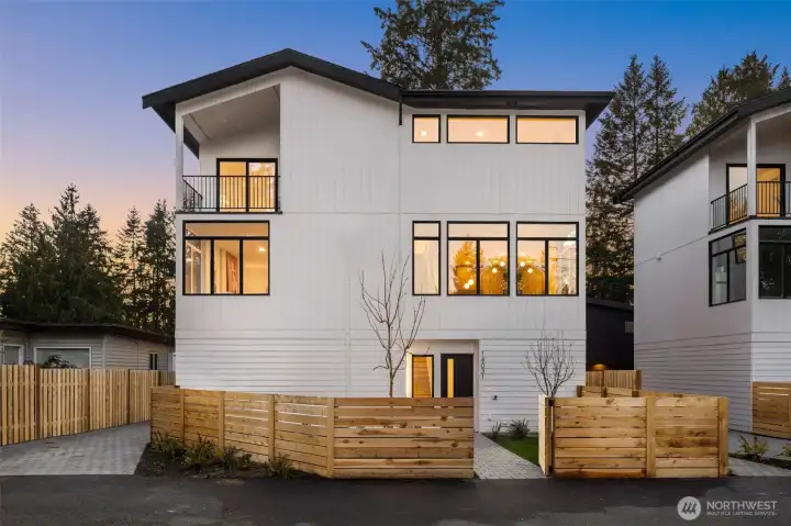 Welcome to modern luxury. Striking architectural lines paired with warm wood accents create an unforgettable first impression.