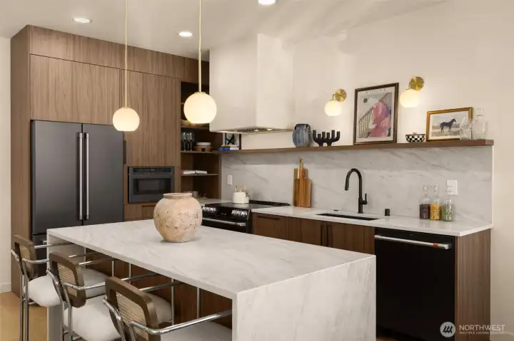 Slab backsplash, matching the countertops Slab backsplash, matching the countertops