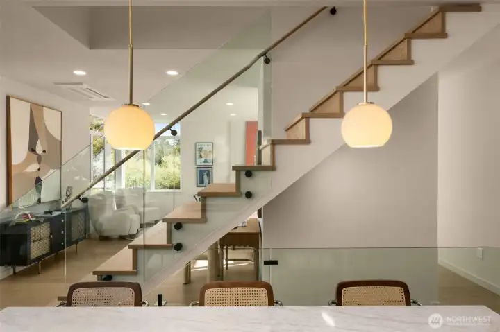 sleek glass railing, keeping the space feeling open and airy sleek glass railing, keeping the space feeling open and airy