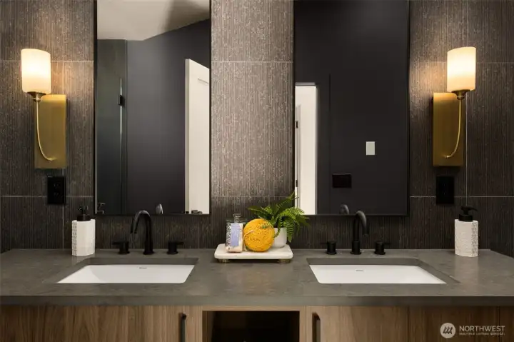 The floating dual vanity offers ample storage space for primary residents