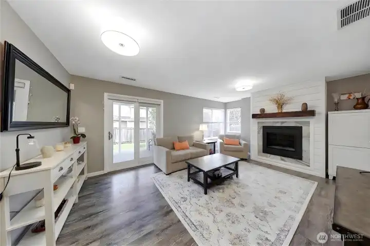 Spacious lower-level rec room with fireplace, backyard access, and excellent income potential.