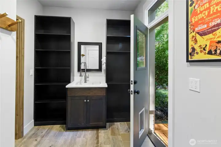 Main floor mud room with access to back yard and 2 car attached garage.