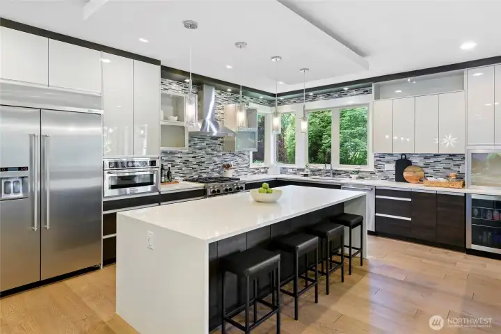 Large island with seating for 4.  Good storage space, Kitchen Aid appliance package.