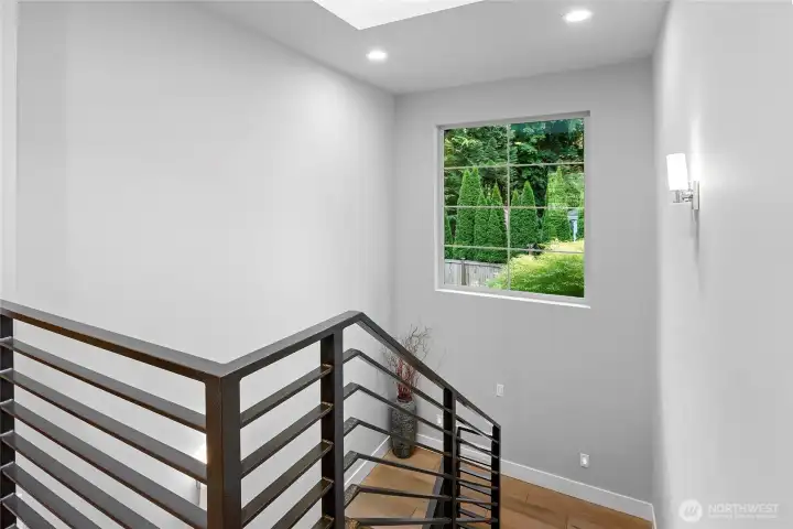 Upstairs includes 3 bedrooms, another office and a large media room.