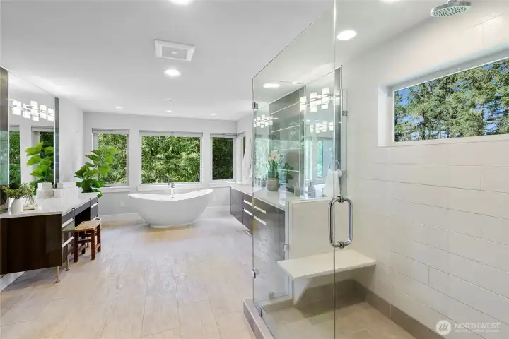 Primary bathroom is spacious and luxurious.