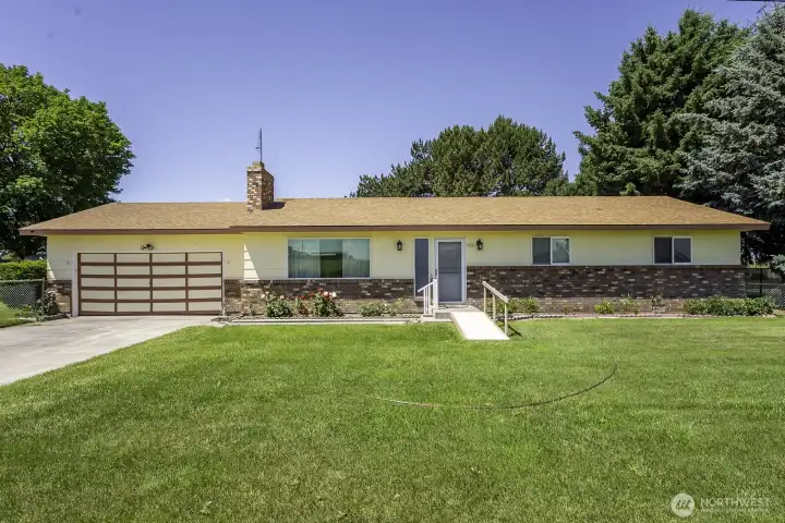 Classic home with newer roof and nice green grass