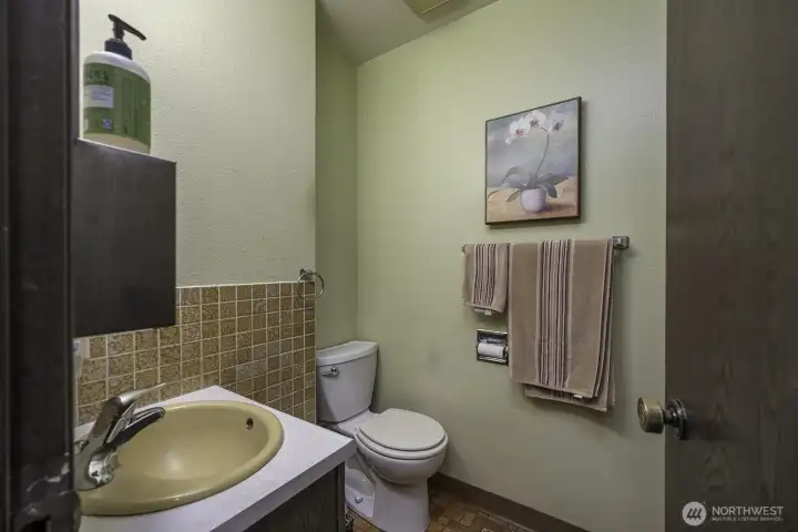 1/2 bath by kitchen