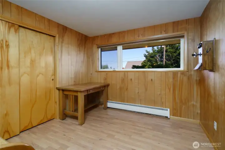 Bedroom #1 with paneling and laminate floors