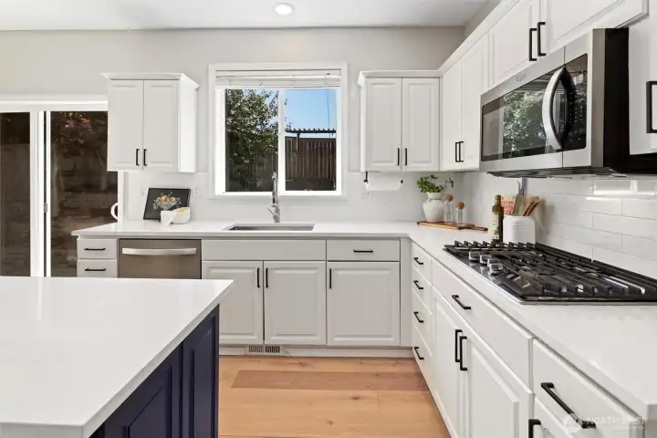 Updated kitchen with stainless steel appliances including gas range, shaker cabinets, walk-in pantry Updated kitchen with stainless steel appliances including gas range, shaker cabinets, walk-in pantry