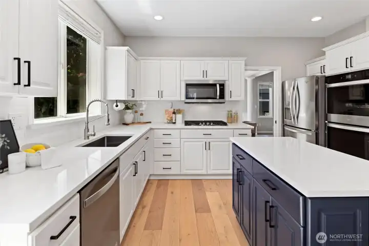 Updated kitchen with stainless steel appliances including gas range, shaker cabinets, walk-in pantry Updated kitchen with stainless steel appliances including gas range, shaker cabinets, walk-in pantry