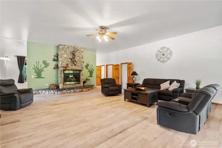 Beautiful river rock gas fireplace in spacious great room. Beautiful river rock gas fireplace in spacious great room.