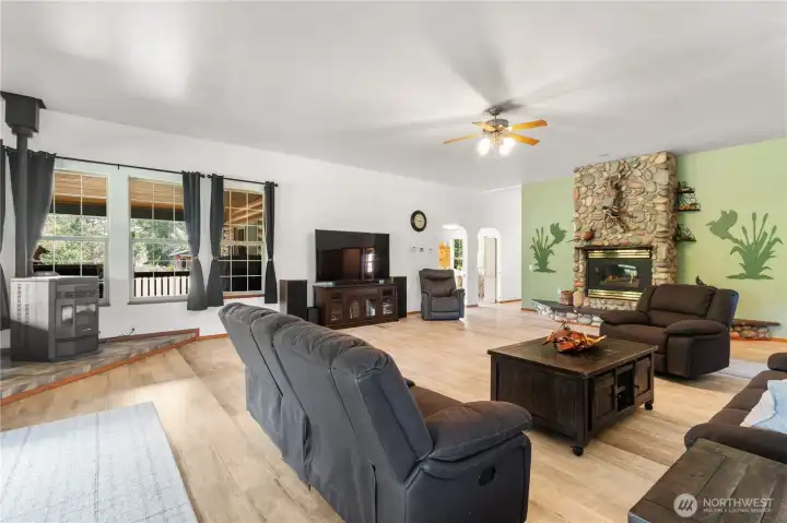 Large open great room with gas fireplace and pellet stove, plenty of natural light with all the windows around. Large open great room with gas fireplace and pellet stove, plenty of natural light with all the windows around.