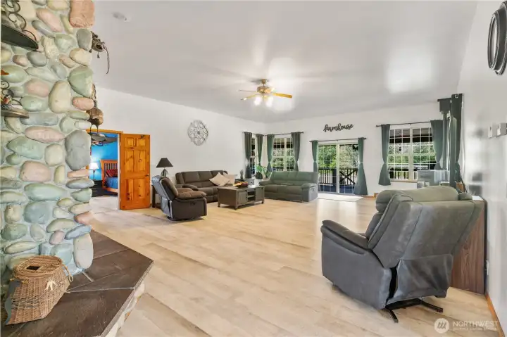 Looking from entry way into spacious great room with easy access through sliding door to the huge covered back deck. Looking from entry way into spacious great room with easy access through sliding door to the huge covered back deck.