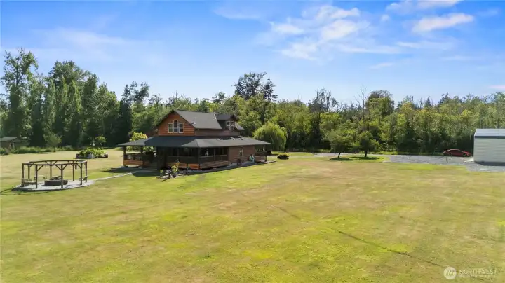 Beautiful flat lawn with gardens, fruit trees, and room to add! Beautiful flat lawn with gardens, fruit trees, and room to add!